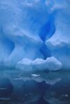 Eroded Base of Iceberg in Snowstorm, Pleneau Island, Antarctic Peninsula, Antarctica