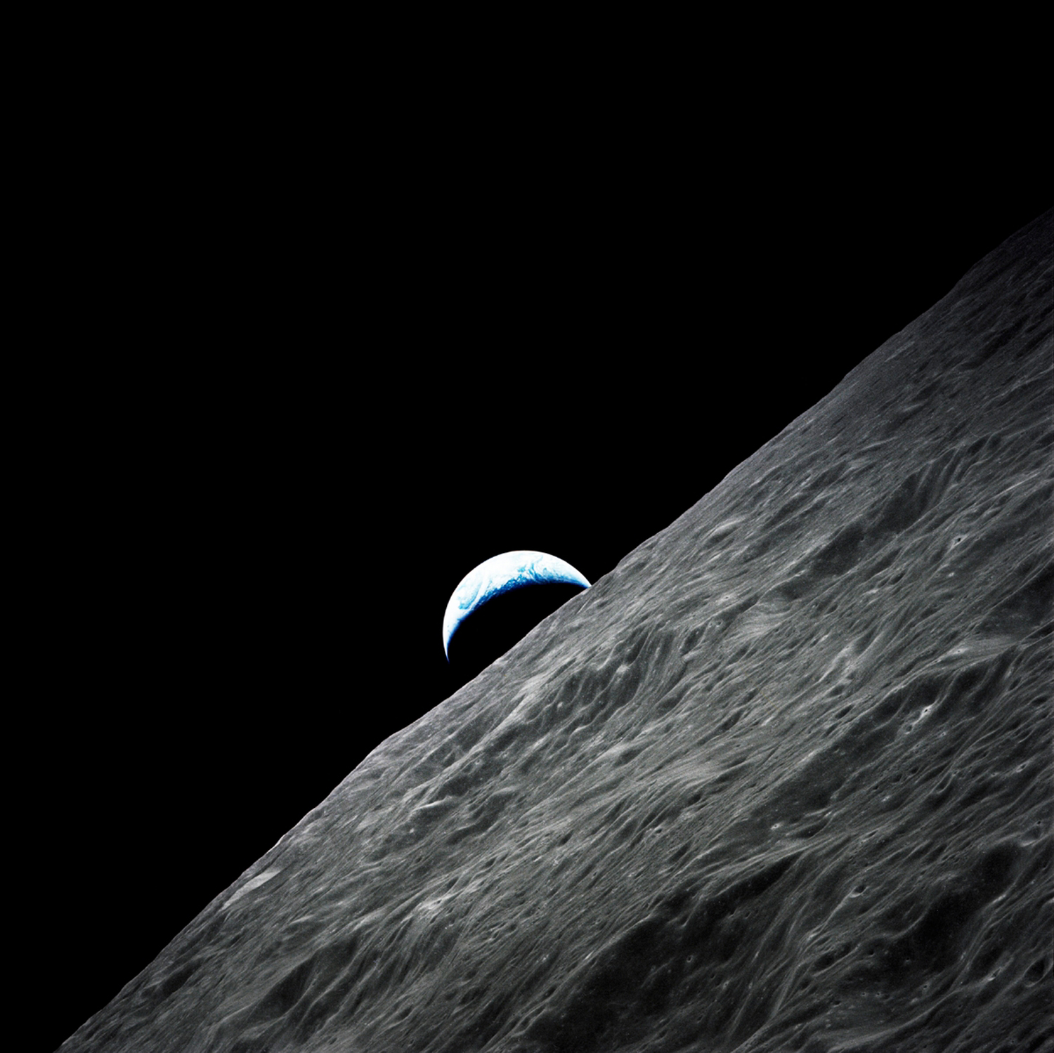 Crescent Earth Rises Above the Lunar Horizon