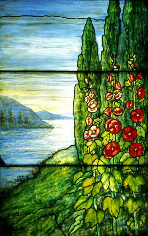 Red Blossoming Hollyhocks and Arbor Vitae