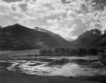 Lake and Trees in Foreground, Mountains and Clouds in Background, in Rocky Mountain National Park, Colorado, ca. 1941-1942