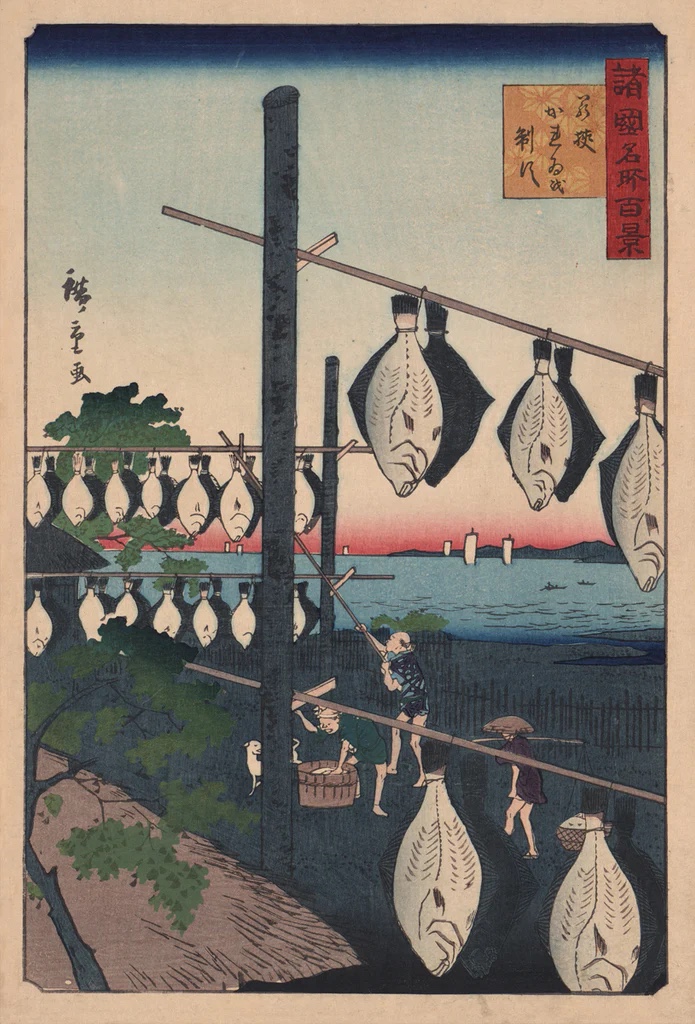Fishermen Frying Flatfish On Racks