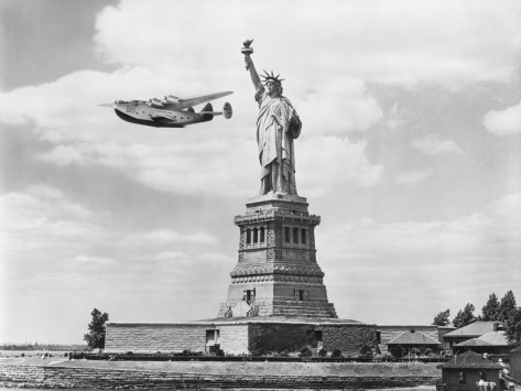 Seaplane Flying by the Statue of Liberty